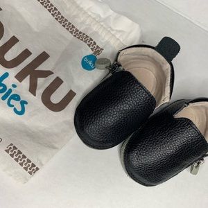 Buku Shoes | A black genuine leather bootie.